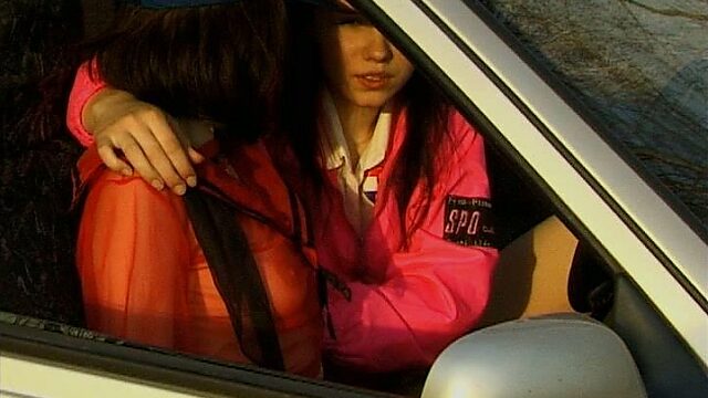 Two girlfriends are fingering each others slit in the car