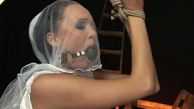 Gagged and tied up brunette bride gets her pussy fingered tough by spoiled man