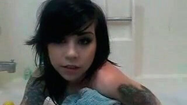 Raven haired emo bitch with tattooes takes dirty shower