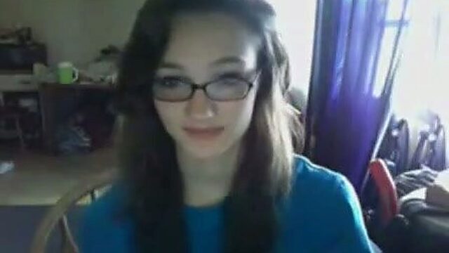 juggy nerdy brunette in glasses having fun on webcam
