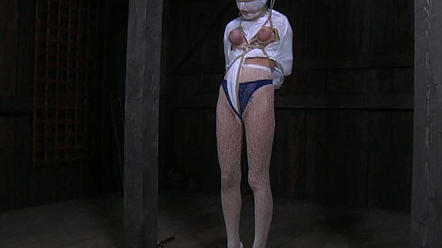 Restrained sex-slave with mask on her head gets punished in the dungeon