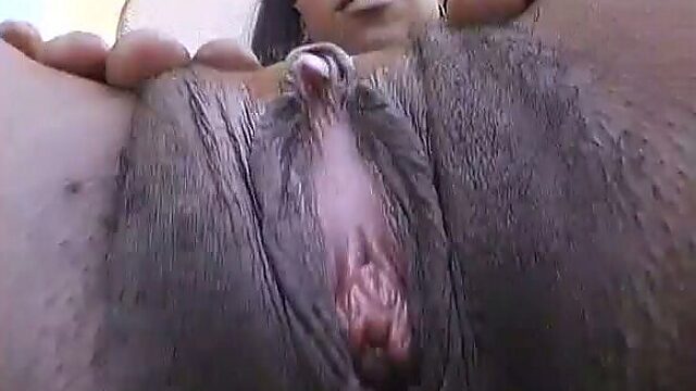 This black chick has a long tongue and she knows how to masturbate