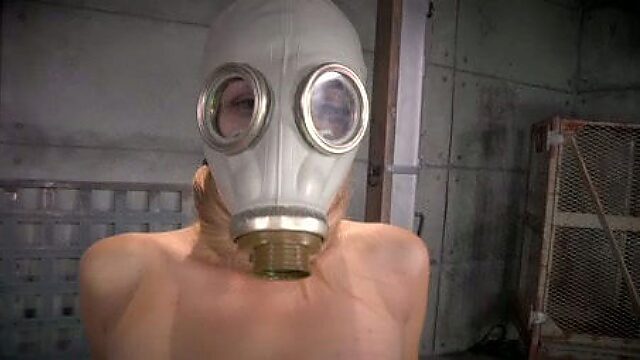 Restrained chick in gas mask is fucked by brutal BBC