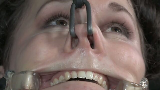 Hooks in nose make tied up chick moans with pain