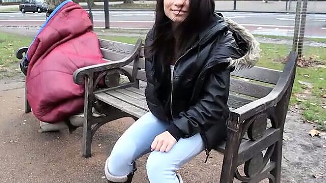 Lewd amateur brunette girlie in jeans pisses while sitting on the bench