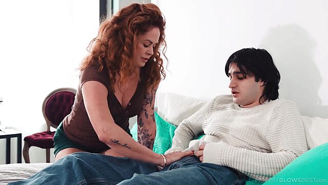 Ginger MILF grants a young guy with her amazing mouth